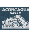 A rectangular navy blue flag featuring a white line-art illustration of a mountain and large text reading 'ACONCAGUA 6,962 M' with additional summit text at the bottom.
