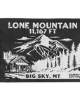 A charcoal summit flag depicting the classic  dramatic view of Lone Mountain and with Lone Mountain and elevation of in white text the name of Lone Mountain and the 11,167 elevation written in white text at the top and Big Sky, MT written at the bottom.